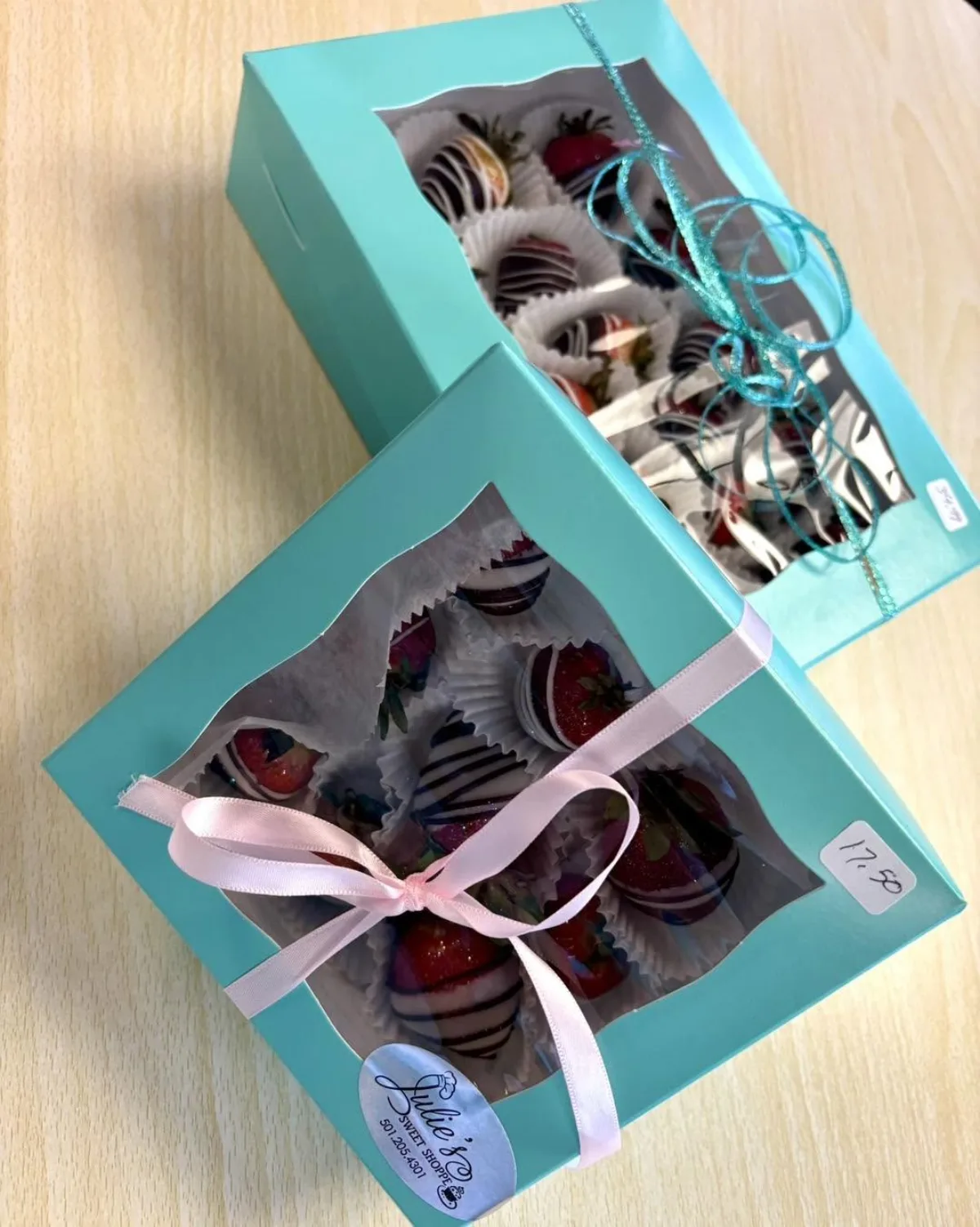 Chocolate-dipped strawberries in Julie's blue boxes, tied with ribbon
